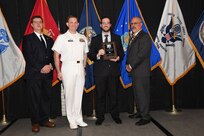 IMAGE: Patrick Mead is presented the Dr. Charles J. Cohen Award at Naval Surface Warfare Center Dahlgren Division's annual awards ceremony, Apr. 26 at the Fredericksburg Expo and Conference Center.

The award recognizes those who fundamentally impact science or technology with work that also measurably impacts capability.