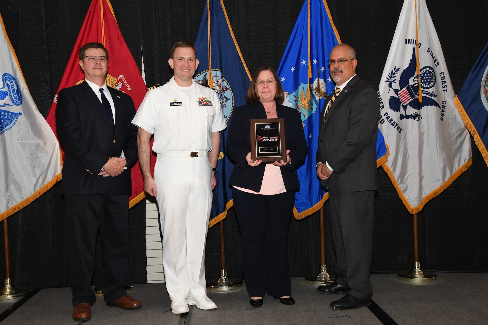 IMAGE: Nancy Taylor is presented the NSWCDD Award of Excellence for Analysis at Naval Surface Warfare Center Dahlgren Division's annual awards ceremony, Apr. 26 at the Fredericksburg Expo and Conference Center.

The NSWCDD Award of Excellence for Analysis is newly established to recognize individuals who have made a notable and significant impact to NSWCDD through their outstanding performance in analysis - warfare, design, engineering, modeling and simulation.