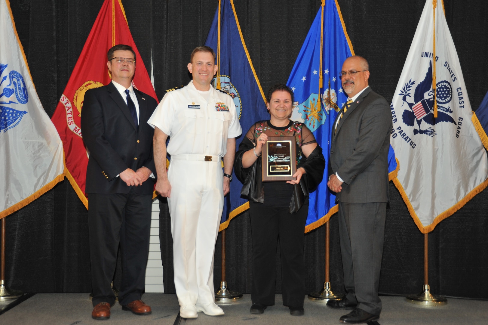 IMAGE: Carol Lee is presented the  NSWCDD Award of Excellence for Software Engineering and Integration at Naval Surface Warfare Center Dahlgren Division's annual awards ceremony, Apr. 26 at the Fredericksburg Expo and Conference Center.

The NSWCDD Award of Excellence for Software Engineering and Integration was established to recognize individuals who have made a notable and significant impact to NSWCDD through their outstanding performance in Software Engineering & Integration.