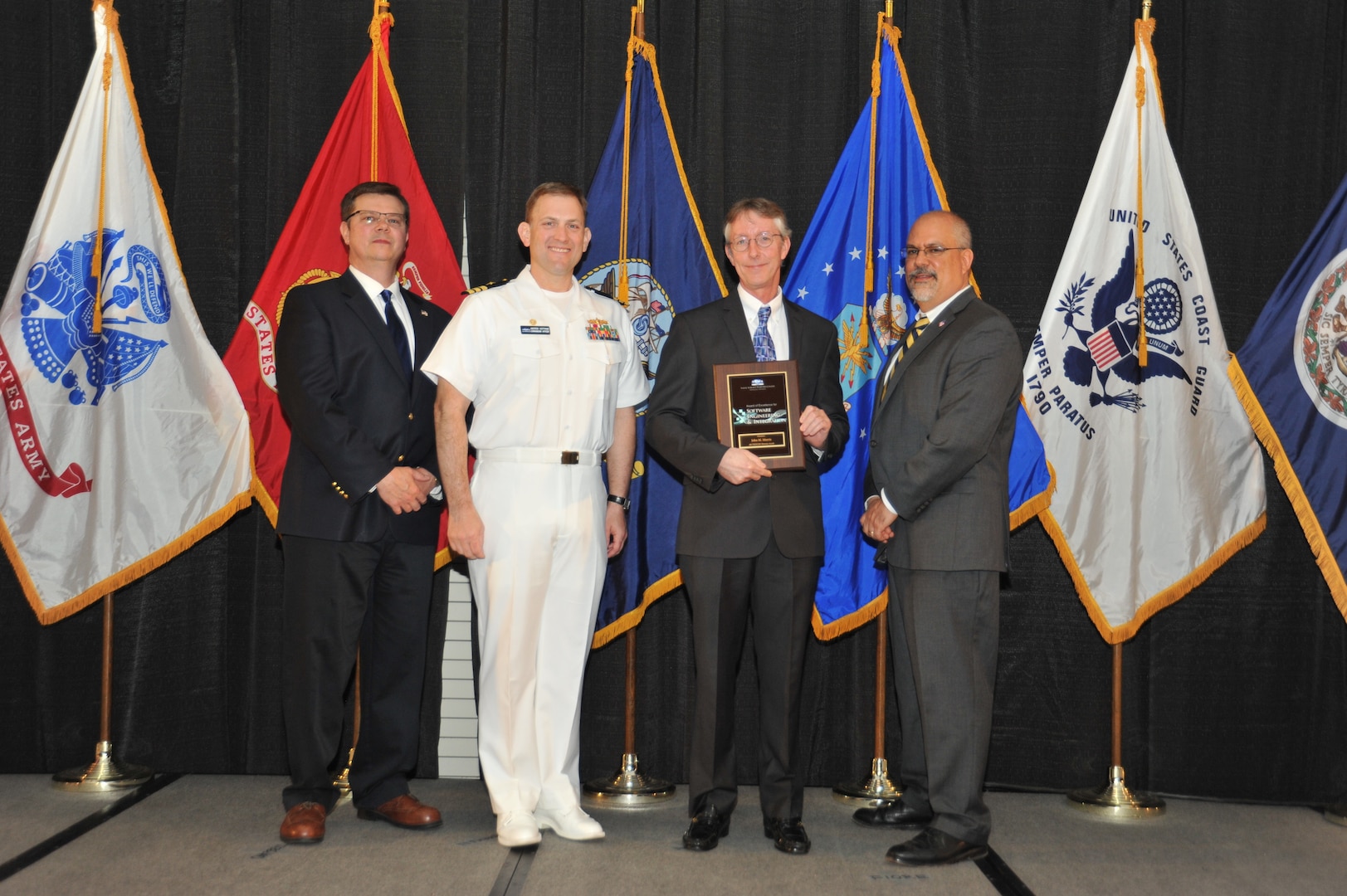 IMAGE: John Morris is presented the  NSWCDD Award of Excellence for Software Engineering and Integration at Naval Surface Warfare Center Dahlgren Division's annual awards ceremony, Apr. 26 at the Fredericksburg Expo and Conference Center.

The NSWCDD Award of Excellence for Software Engineering and Integration was established to recognize individuals who have made a notable and significant impact to NSWCDD through their outstanding performance in Software Engineering & Integration.