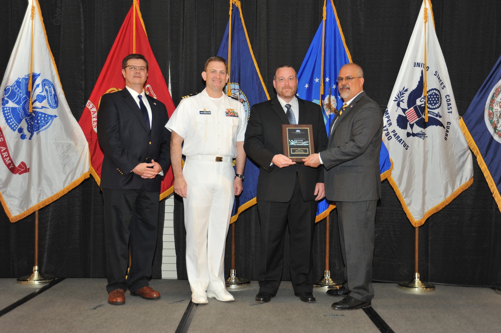 IMAGE: Micah Colon is presented the  NSWCDD Award of Excellence for Software Engineering and Integration at Naval Surface Warfare Center Dahlgren Division's annual awards ceremony, Apr. 26 at the Fredericksburg Expo and Conference Center.

The NSWCDD Award of Excellence for Software Engineering and Integration was established to recognize individuals who have made a notable and significant impact to NSWCDD through their outstanding performance in Software Engineering & Integration.