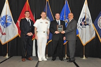 IMAGE: Micah Colon is presented the  NSWCDD Award of Excellence for Software Engineering and Integration at Naval Surface Warfare Center Dahlgren Division's annual awards ceremony, Apr. 26 at the Fredericksburg Expo and Conference Center.

The NSWCDD Award of Excellence for Software Engineering and Integration was established to recognize individuals who have made a notable and significant impact to NSWCDD through their outstanding performance in Software Engineering & Integration.