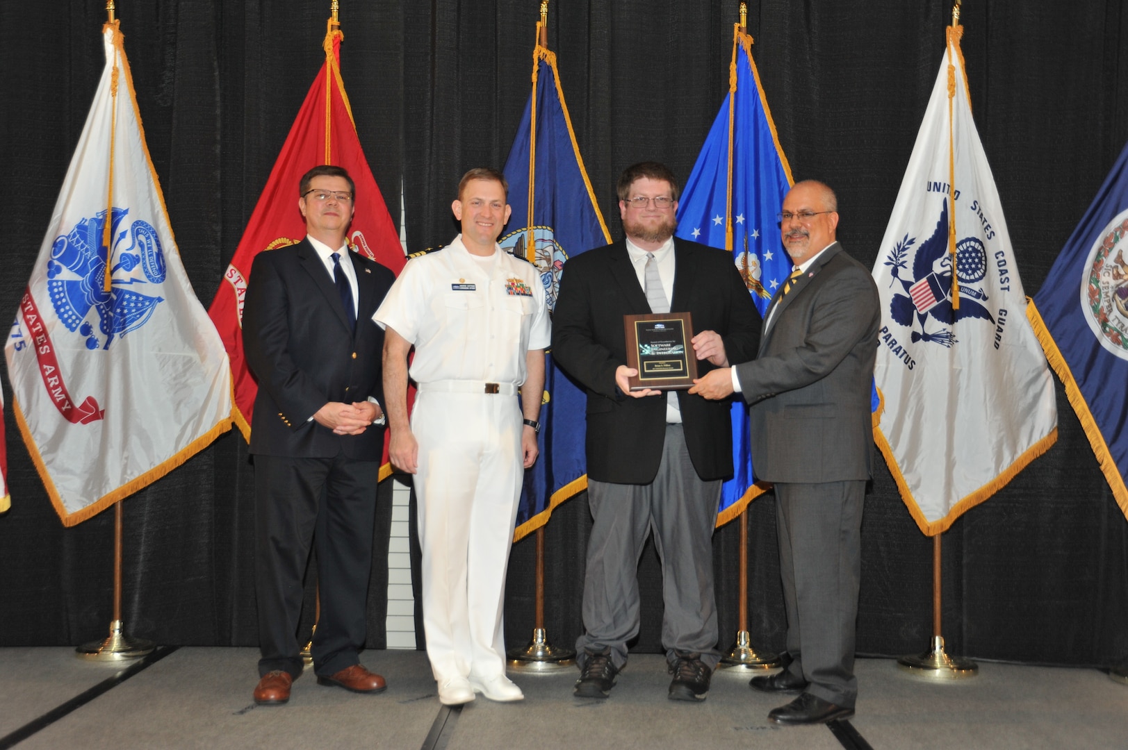 IMAGE: Brian Dillon is presented the  NSWCDD Award of Excellence for Software Engineering and Integration at Naval Surface Warfare Center Dahlgren Division's annual awards ceremony, Apr. 26 at the Fredericksburg Expo and Conference Center.

The NSWCDD Award of Excellence for Software Engineering and Integration was established to recognize individuals who have made a notable and significant impact to NSWCDD through their outstanding performance in Software Engineering & Integration.