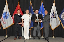 IMAGE: Brian Dillon is presented the  NSWCDD Award of Excellence for Software Engineering and Integration at Naval Surface Warfare Center Dahlgren Division's annual awards ceremony, Apr. 26 at the Fredericksburg Expo and Conference Center.

The NSWCDD Award of Excellence for Software Engineering and Integration was established to recognize individuals who have made a notable and significant impact to NSWCDD through their outstanding performance in Software Engineering & Integration.