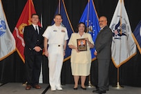 IMAGE: Jeannie Hobgood is presented the Award of Excellence for Systems Engineering and Integration at Naval Surface Warfare Center Dahlgren Division's annual awards ceremony, Apr. 26 at the Fredericksburg Expo and Conference Center.

The Award of Excellence for Systems Engineering and Integration was established to recognize individuals who have made a notable and significant impact to NSWCDD through their outstanding performance in systems engineering and integration.