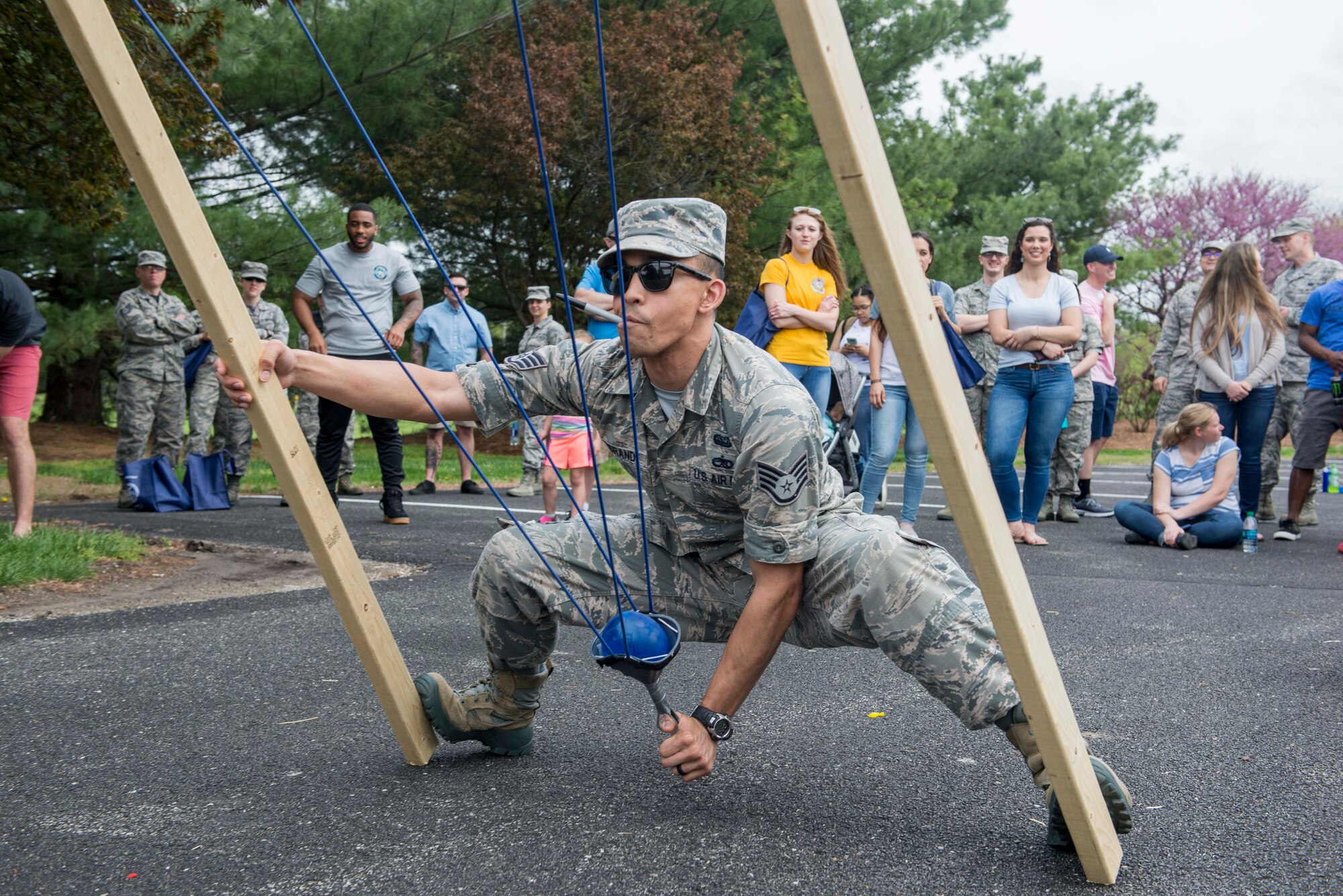 Staff Sgt. Joseph Logrande, 561st Network Operations Squadron Detachment 3, pulls back a water balloon sling shot at Scott Air Force Base’s annual Spring Fling and Diversity Day event, May 4, 2018. The event featured a squadron water balloon slingshot contest, where teams built their own slingshot and shot at targets to earn points. (U.S. Air Force photo by Airman 1st Class Chad Gorecki)