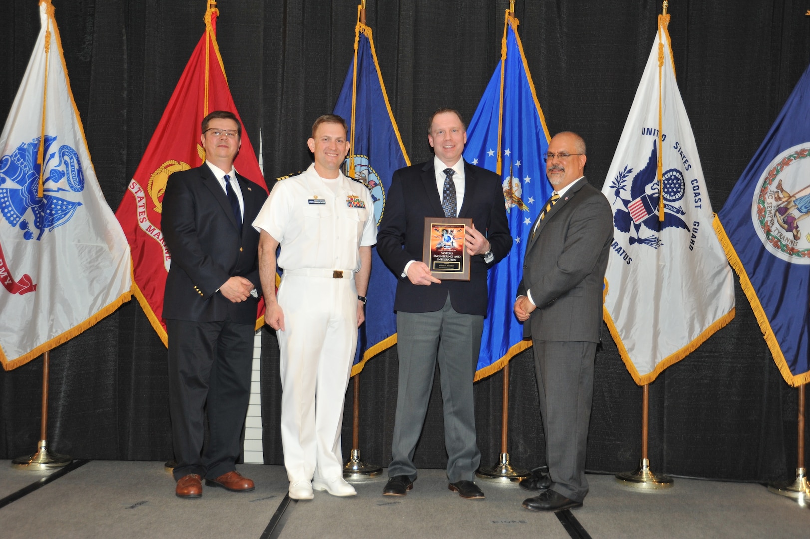 IMAGE: William Bradshaw is presented the Award of Excellence for Systems Engineering and Integration at Naval Surface Warfare Center Dahlgren Division's annual awards ceremony, Apr. 26 at the Fredericksburg Expo and Conference Center.

The Award of Excellence for Systems Engineering and Integration was established to recognize individuals who have made a notable and significant impact to NSWCDD through their outstanding performance in systems engineering and integration.