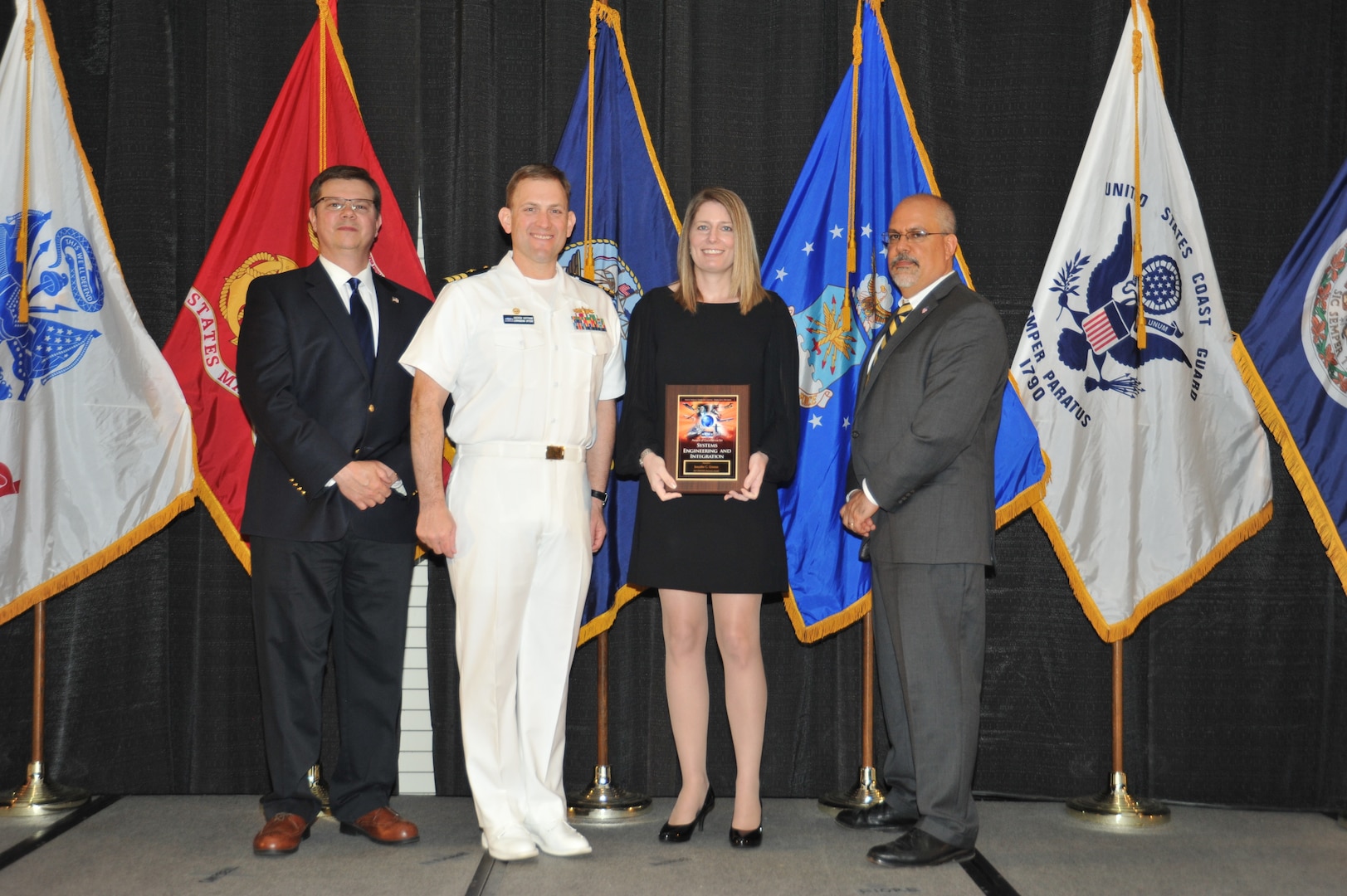 IMAGE: Jennifer Greene is presented the Award of Excellence for Systems Engineering and Integration at Naval Surface Warfare Center Dahlgren Division's annual awards ceremony, Apr. 26 at the Fredericksburg Expo and Conference Center.

The Award of Excellence for Systems Engineering and Integration was established to recognize individuals who have made a notable and significant impact to NSWCDD through their outstanding performance in systems engineering and integration.