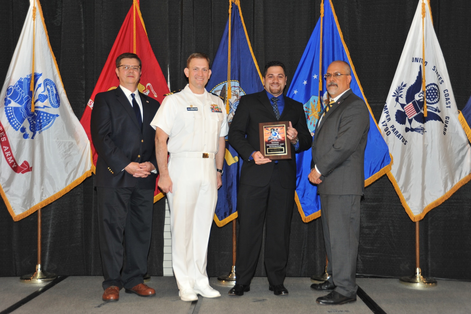 IMAGE: Emil Jimenez-Brea is presented the Award of Excellence for Systems Engineering and Integration at Naval Surface Warfare Center Dahlgren Division's annual awards ceremony, Apr. 26 at the Fredericksburg Expo and Conference Center.

The Award of Excellence for Systems Engineering and Integration was established to recognize individuals who have made a notable and significant impact to NSWCDD through their outstanding performance in systems engineering and integration.