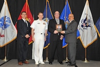 IMAGE: Claiborne Doxey is presented the Award of Excellence for Systems Engineering and Integration at Naval Surface Warfare Center Dahlgren Division's annual awards ceremony, Apr. 26 at the Fredericksburg Expo and Conference Center.

The Award of Excellence for Systems Engineering and Integration was established to recognize individuals who have made a notable and significant impact to NSWCDD through their outstanding performance in systems engineering and integration.