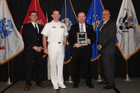 IMAGE: Jeffrey Bunn is presented the NSWCDD Award of Excellence for Test & Evaluation at Naval Surface Warfare Center Dahlgren Division's annual awards ceremony, Apr. 26 at the Fredericksburg Expo and Conference Center.

The NSWCDD Award of Excellence for Test & Evaluation was established to recognize individuals who have made a notable and significant impact to NSWCDD through their outstanding performance in Test and Evaluation, the collection, analysis, and assessment of data to characterize and/or measure the performance of a component, system, platform, or mission.