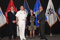 IMAGE: Laura Ruff is presented the NSWCDD Award of Excellence for Test & Evaluation at Naval Surface Warfare Center Dahlgren Division's annual awards ceremony, Apr. 26 at the Fredericksburg Expo and Conference Center.

The NSWCDD Award of Excellence for Test & Evaluation was established to recognize individuals who have made a notable and significant impact to NSWCDD through their outstanding performance in Test and Evaluation, the collection, analysis, and assessment of data to characterize and/or measure the performance of a component, system, platform, or mission.