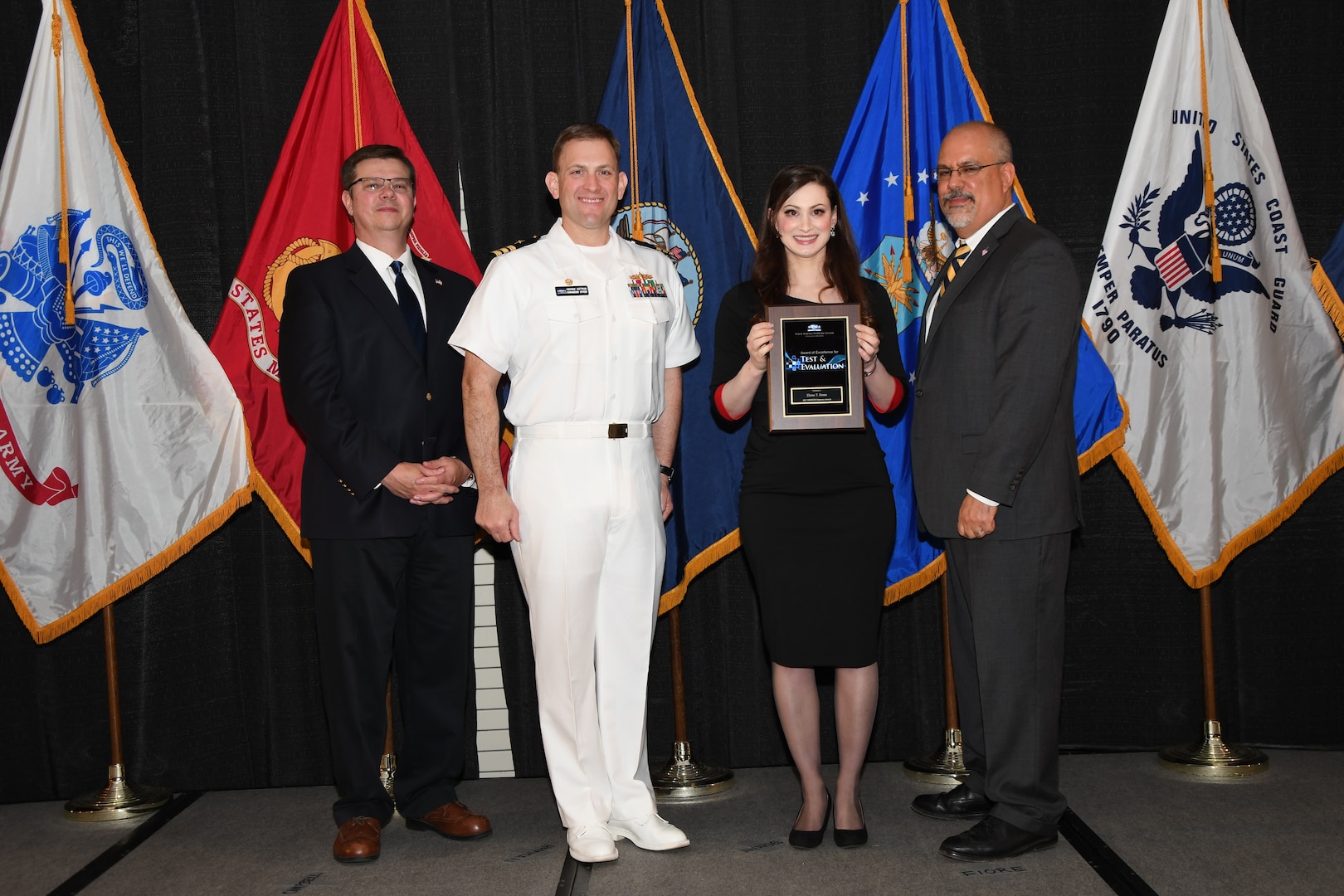 IMAGE: Elena Bono is presented the NSWCDD Award of Excellence for Test & Evaluation at Naval Surface Warfare Center Dahlgren Division's annual awards ceremony, Apr. 26 at the Fredericksburg Expo and Conference Center.

The NSWCDD Award of Excellence for Test & Evaluation was established to recognize individuals who have made a notable and significant impact to NSWCDD through their outstanding performance in Test and Evaluation, the collection, analysis, and assessment of data to characterize and/or measure the performance of a component, system, platform, or mission.