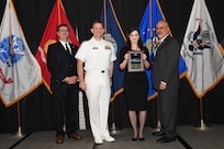 IMAGE: Elena Bono is presented the NSWCDD Award of Excellence for Test & Evaluation at Naval Surface Warfare Center Dahlgren Division's annual awards ceremony, Apr. 26 at the Fredericksburg Expo and Conference Center.

The NSWCDD Award of Excellence for Test & Evaluation was established to recognize individuals who have made a notable and significant impact to NSWCDD through their outstanding performance in Test and Evaluation, the collection, analysis, and assessment of data to characterize and/or measure the performance of a component, system, platform, or mission.