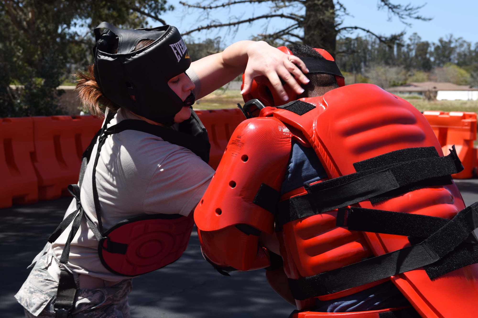 A 30th Security Forces member makes a move on his assailant at Vandenberg Air Force Base, May 2, 2018. This day’s training includes hours of group fitness intertwined with skilled one-on-one fighting, and coaching from their supervisors. (U.S. Air Force photo by Airman Aubree Milks/Released)