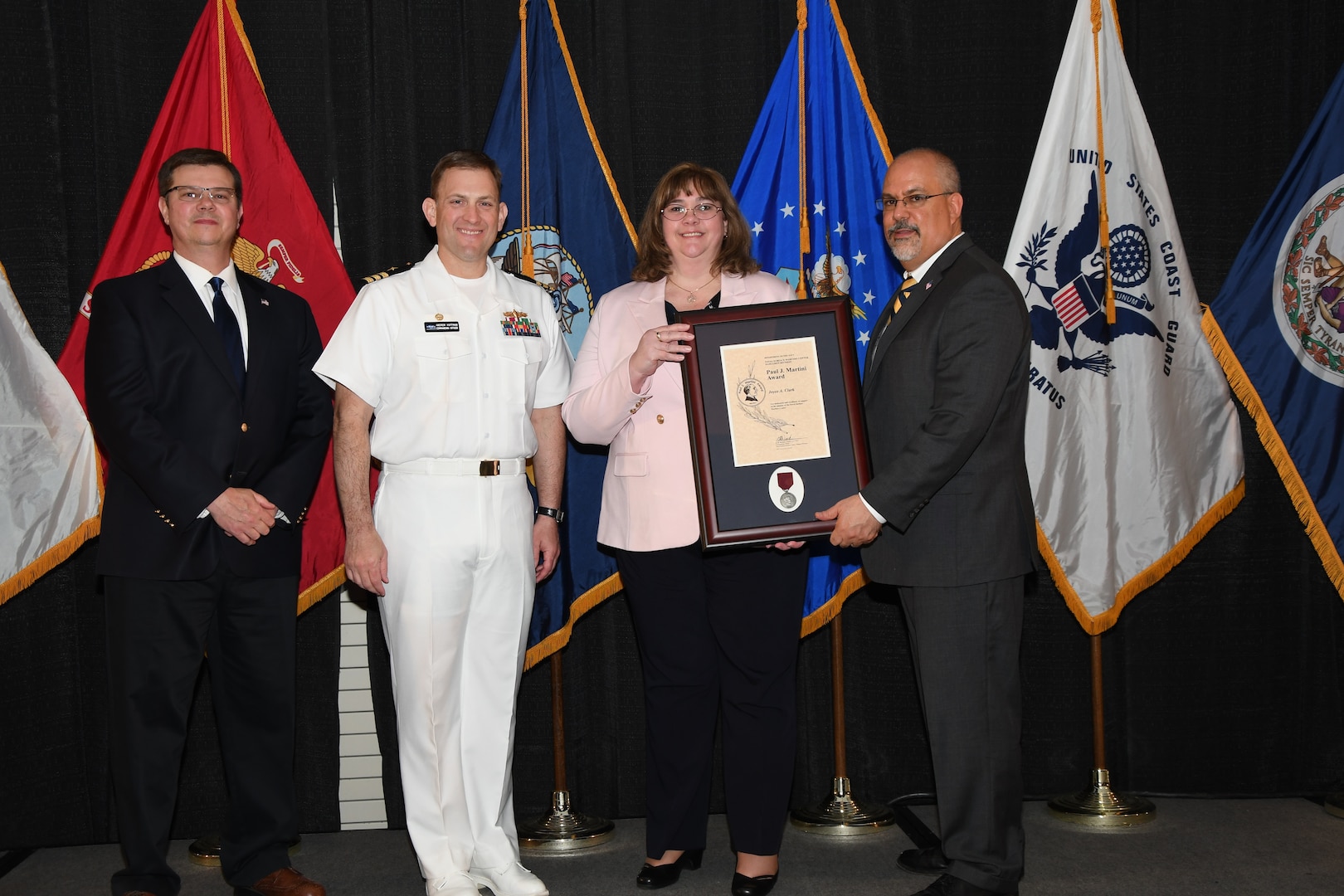 IMAGE: Joyce Clark is presented the Paul J. Martini Award at Naval Surface Warfare Center Dahlgren Division's annual awards ceremony, Apr. 26 at the Fredericksburg Expo and Conference Center.

The award is named in honor of Paul J. Martini, who was head of the Engineering Support Directorate of the Naval Ordnance Laboratory from November 1951 to December 1973.