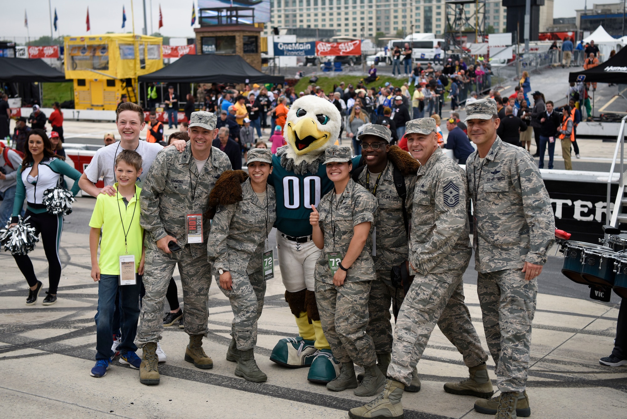 Members from Team Dover get a picture with the Philadelphia Eagles mascot at the “AAA 400 Drive for Autism” Monster Energy NASCAR Cup Series race May 6, 2018 at Dover International Speedway, Del. Players from the Philadelphia Eagles participated in the opening ceremonies prior to the start of the race. (U.S. Air Force photo by Airman 1st Class Zoe M. Wockenfuss)