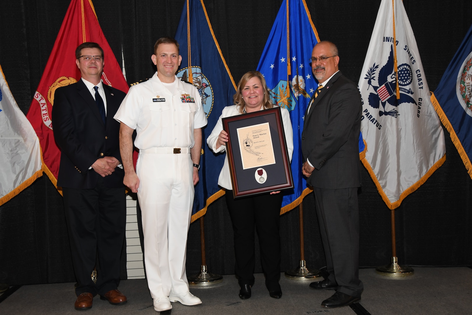 IMAGE: Sheril McLeod is presented the Paul J. Martini Award at Naval Surface Warfare Center Dahlgren Division's annual awards ceremony, Apr. 26 at the Fredericksburg Expo and Conference Center.

The award is named in honor of Paul J. Martini, who was head of the Engineering Support Directorate of the Naval Ordnance Laboratory from November 1951 to December 1973.