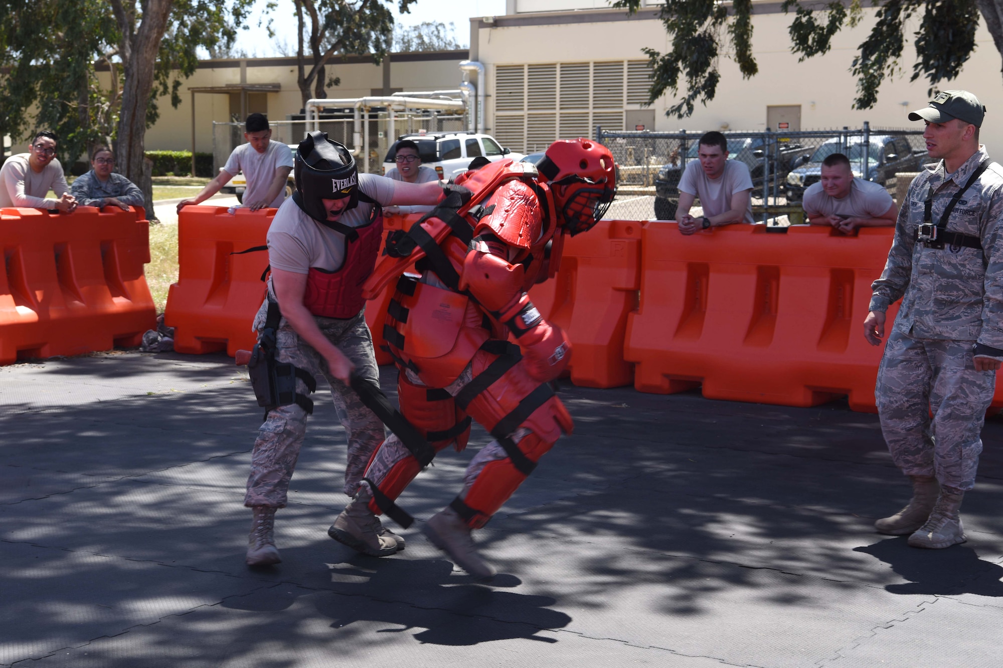 The 30th Security Forces member fights her attacker while others watch her technique at Vandenberg Air Force Base, May 2, 2018. All SF members spend one month out of the year training to improve their skills on the job. (U.S. Air Force photo by Airman Aubree Milks/Released