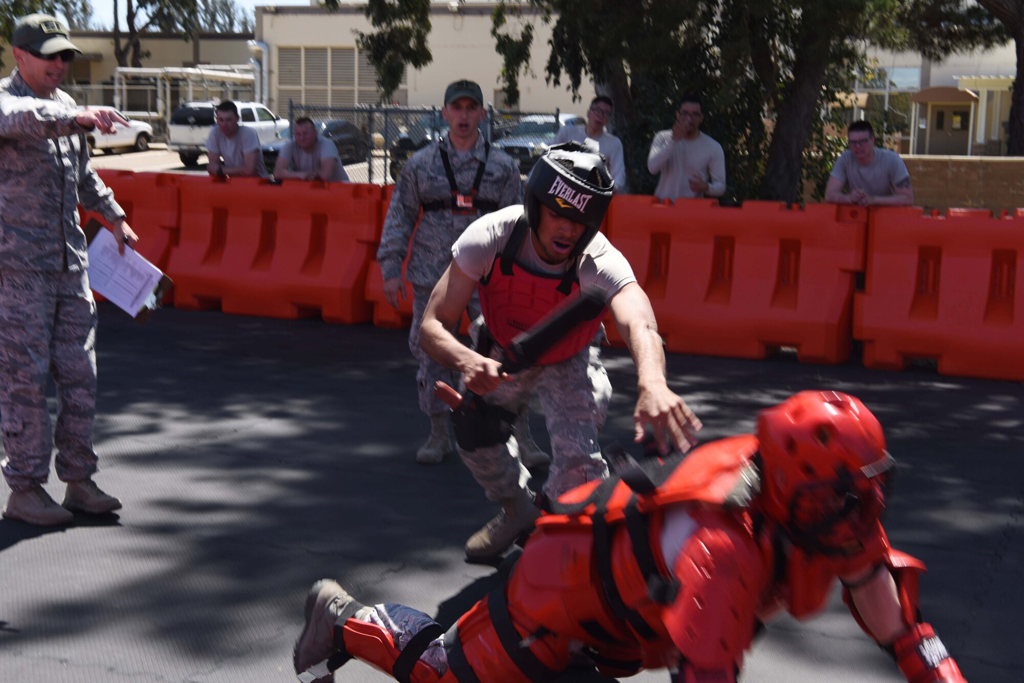 A 30th Security Forces member defeats the perpetrator during training at Vandenberg Air Force Base, May 2, 2018. The Red Man training is a way for SF members to practice their combative skills and to restrain a trespasser with coaching from their supervisors. (U.S. Air Force photo by Airman Aubree Milks/Released)