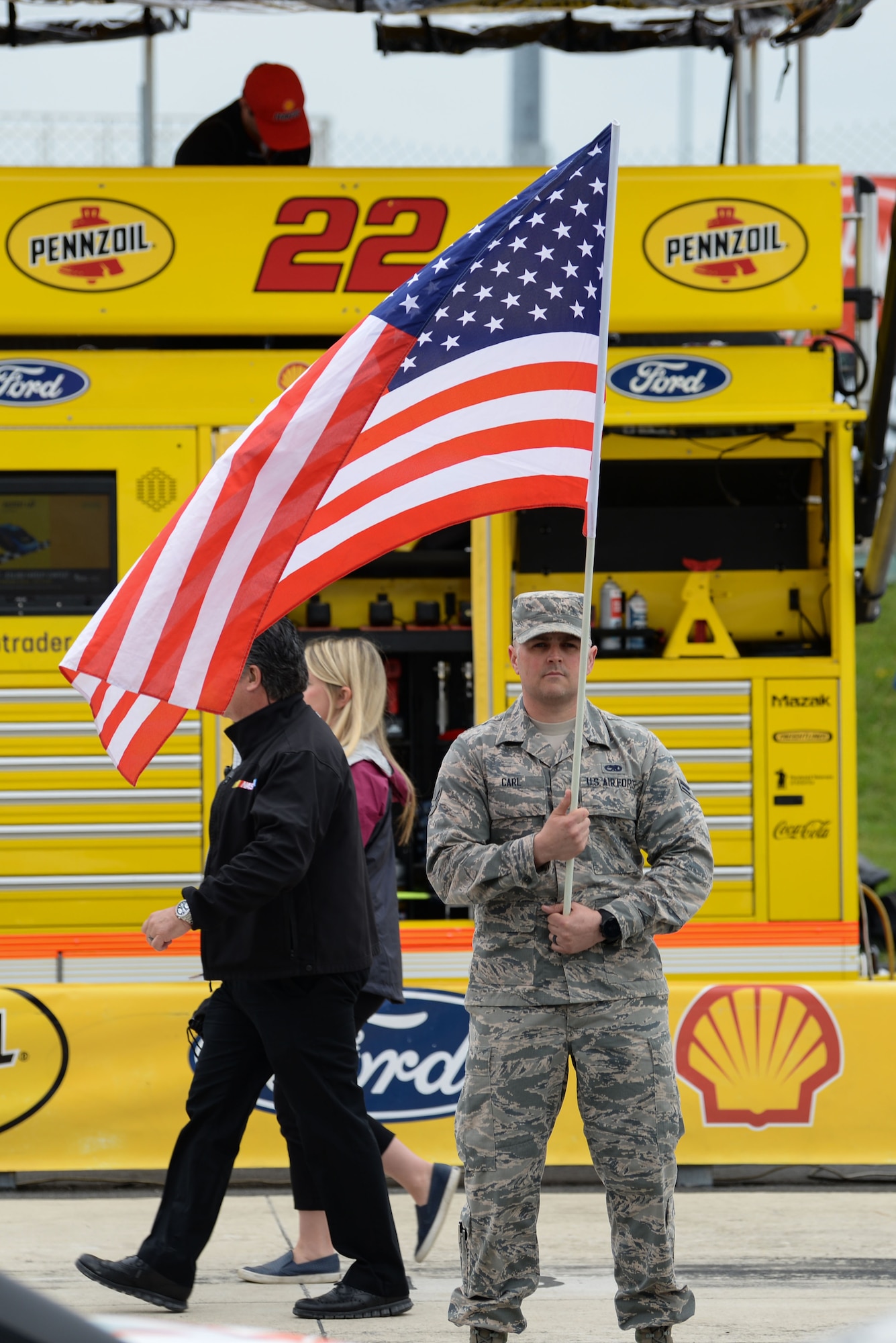 Airman 1st Class Michael Carl, 166th Maintenance Squadron non-destructive technician, New Castle National Guard Base, Del., holds an American Flag prior to the start of the “AAA 400 Drive for Autism” Monster Energy NASCAR Cup Series Race May 6, 2018, at the Dover International Speedway, Del. Carl and other Airmen participated in the race as volunteers and honorary pit crew members. (U.S. Air Force photo by Airman 1st Class Zoe M. Wockenfuss)