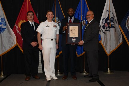 IMAGE: Miguel Curl is presented the Paul J. Martini Award at Naval Surface Warfare Center Dahlgren Division's annual awards ceremony, Apr. 26 at the Fredericksburg Expo and Conference Center.

The award is named in honor of Paul J. Martini, who was head of the Engineering Support Directorate of the Naval Ordnance Laboratory from November 1951 to December 1973.