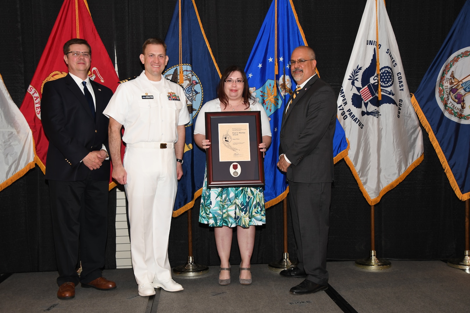 IMAGE: Tanja Hines is presented the Paul J. Martini Award at Naval Surface Warfare Center Dahlgren Division's annual awards ceremony, Apr. 26 at the Fredericksburg Expo and Conference Center.

The award is named in honor of Paul J. Martini, who was head of the Engineering Support Directorate of the Naval Ordnance Laboratory from November 1951 to December 1973.