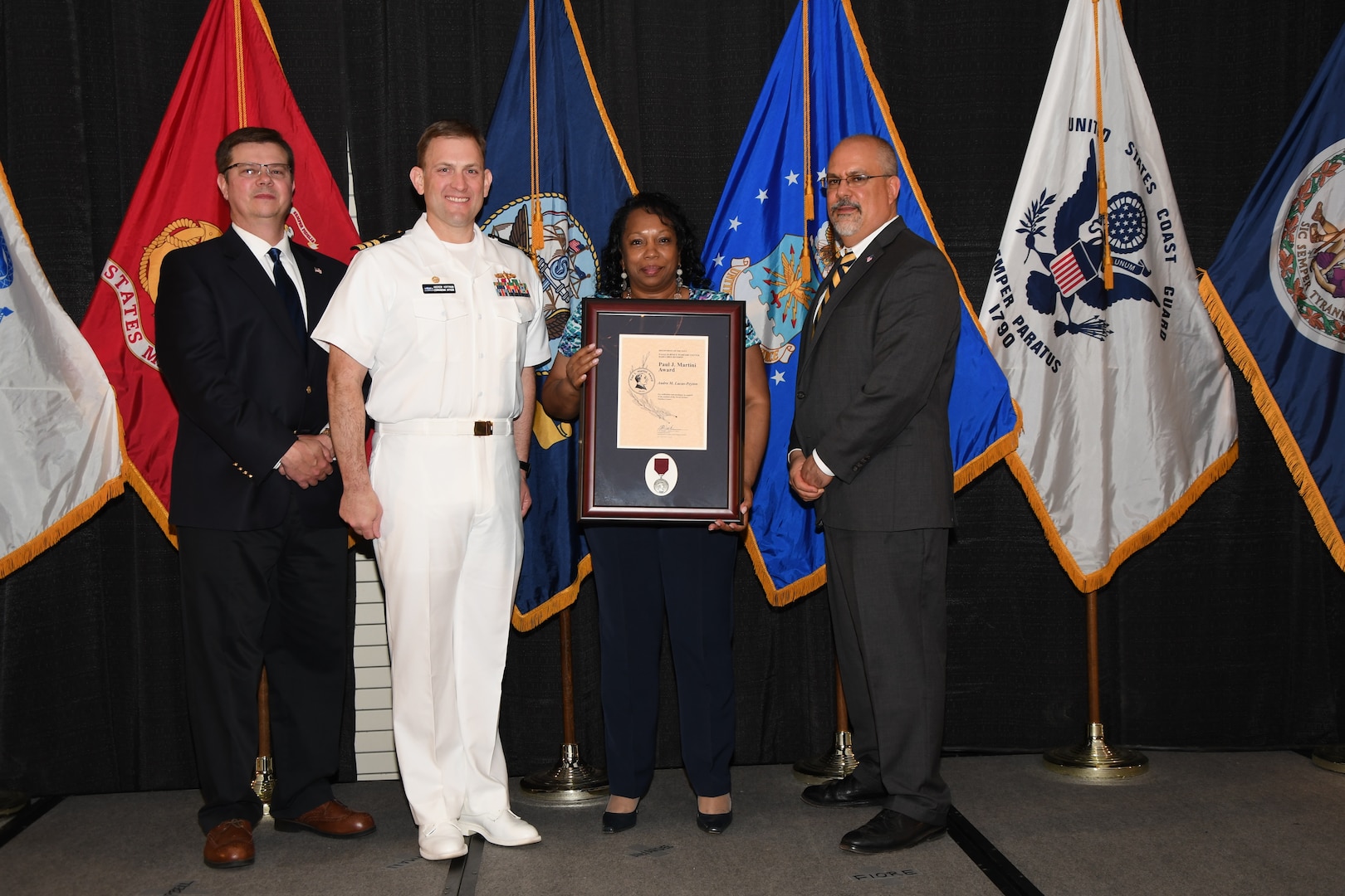 IMAGE: Audra Lucas-Peyton is presented the Paul J. Martini Award at Naval Surface Warfare Center Dahlgren Division's annual awards ceremony, Apr. 26 at the Fredericksburg Expo and Conference Center.

The award is named in honor of Paul J. Martini, who was head of the Engineering Support Directorate of the Naval Ordnance Laboratory from November 1951 to December 1973.