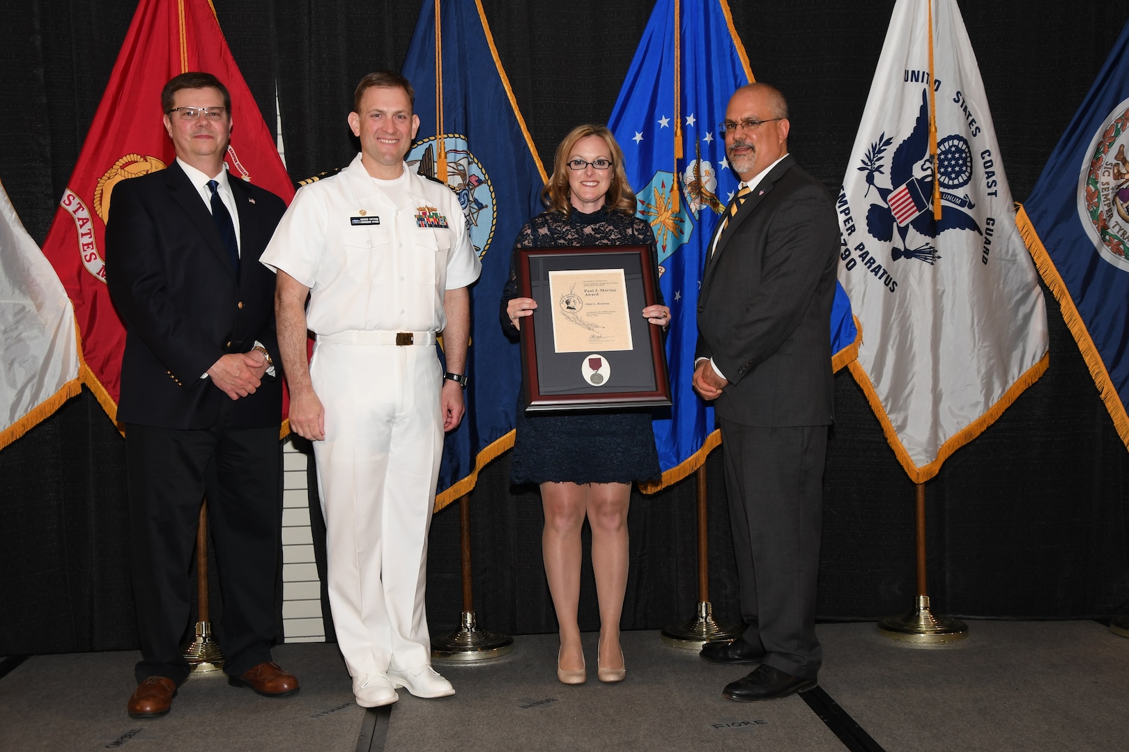 IMAGE: Vikki Rouleau is presented the Paul J. Martini Award at Naval Surface Warfare Center Dahlgren Division's annual awards ceremony, Apr. 26 at the Fredericksburg Expo and Conference Center.

The award is named in honor of Paul J. Martini, who was head of the Engineering Support Directorate of the Naval Ordnance Laboratory from November 1951 to December 1973.