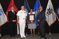 IMAGE: Angela McGee is presented the Paul J. Martini Award at Naval Surface Warfare Center Dahlgren Division's annual awards ceremony, Apr. 26 at the Fredericksburg Expo and Conference Center.

The award is named in honor of Paul J. Martini, who was head of the Engineering Support Directorate of the Naval Ordnance Laboratory from November 1951 to December 1973.