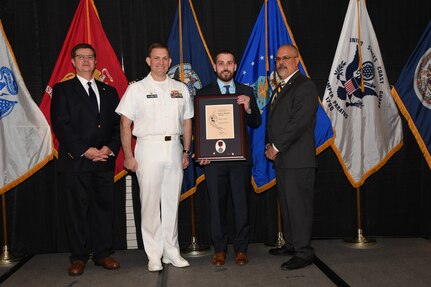 IMAGE: Andrew Mohle is presented the Paul J. Martini Award at Naval Surface Warfare Center Dahlgren Division's annual awards ceremony, Apr. 26 at the Fredericksburg Expo and Conference Center.

The award is named in honor of Paul J. Martini, who was head of the Engineering Support Directorate of the Naval Ordnance Laboratory from November 1951 to December 1973.