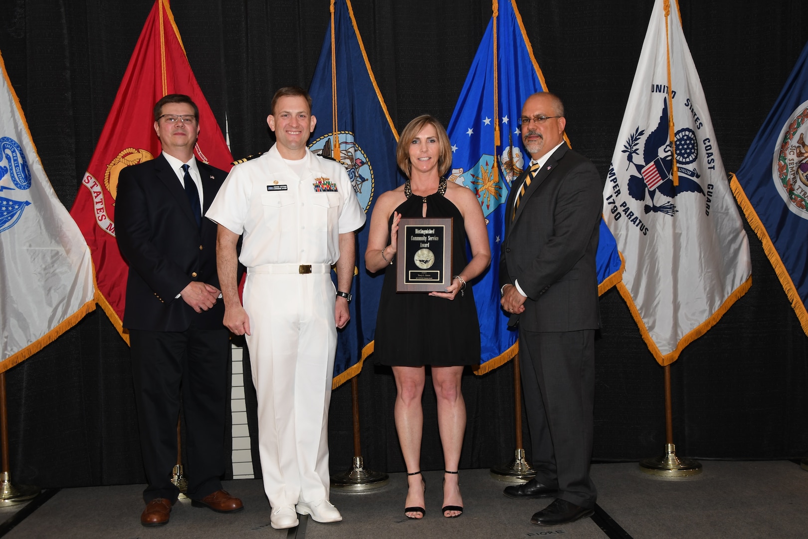 IMAGE: Tracy Sisson is presented the Distinguished Community Service Award at Naval Surface Warfare Center Dahlgren Division's annual awards ceremony, Apr. 26 at the Fredericksburg Expo and Conference Center.