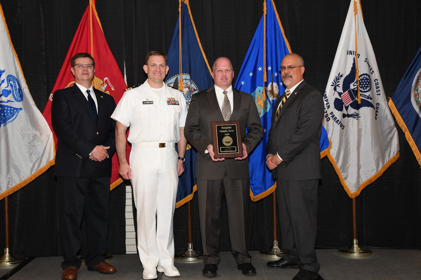 IMAGE: Curtis Dunn is presented the Distinguished Community Service Award at Naval Surface Warfare Center Dahlgren Division's annual awards ceremony, Apr. 26 at the Fredericksburg Expo and Conference Center.