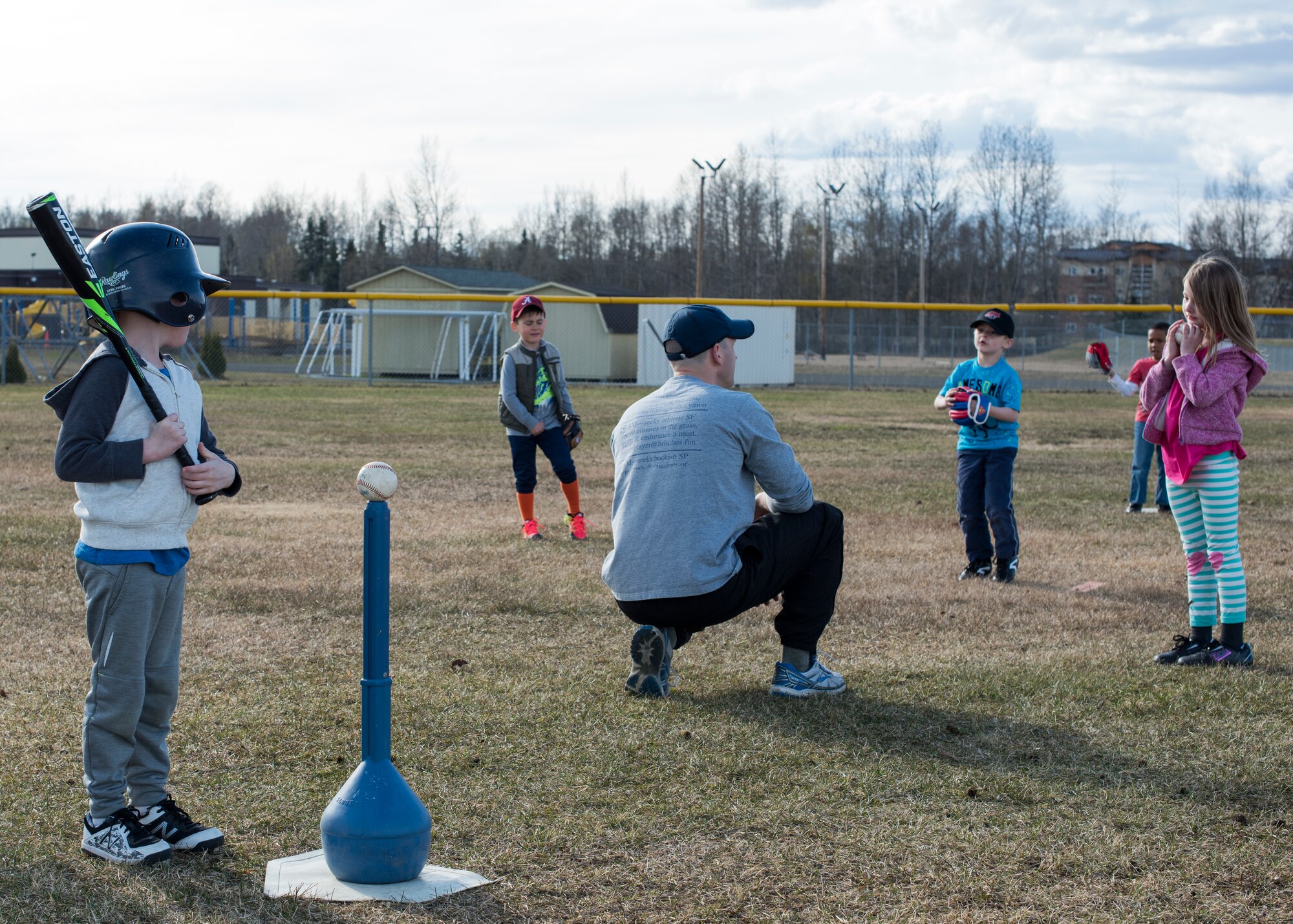 Children registered for the 2018 Youth Sports Program Little League season listen to coaching while learning about playing outfield positions at Joint Base Elmendorf-Richardson, Alaska, May 7, 2018. JBER YSP abides by the National Alliance for Youth Sports-affiliated National Youth Sports Coaches Association, which provides education on topics such as the psychology of coaching youth sports, communication, child abuse, injury prevention, and nutrition and hydration, as well as skills and drills specifically applicable to each sport.