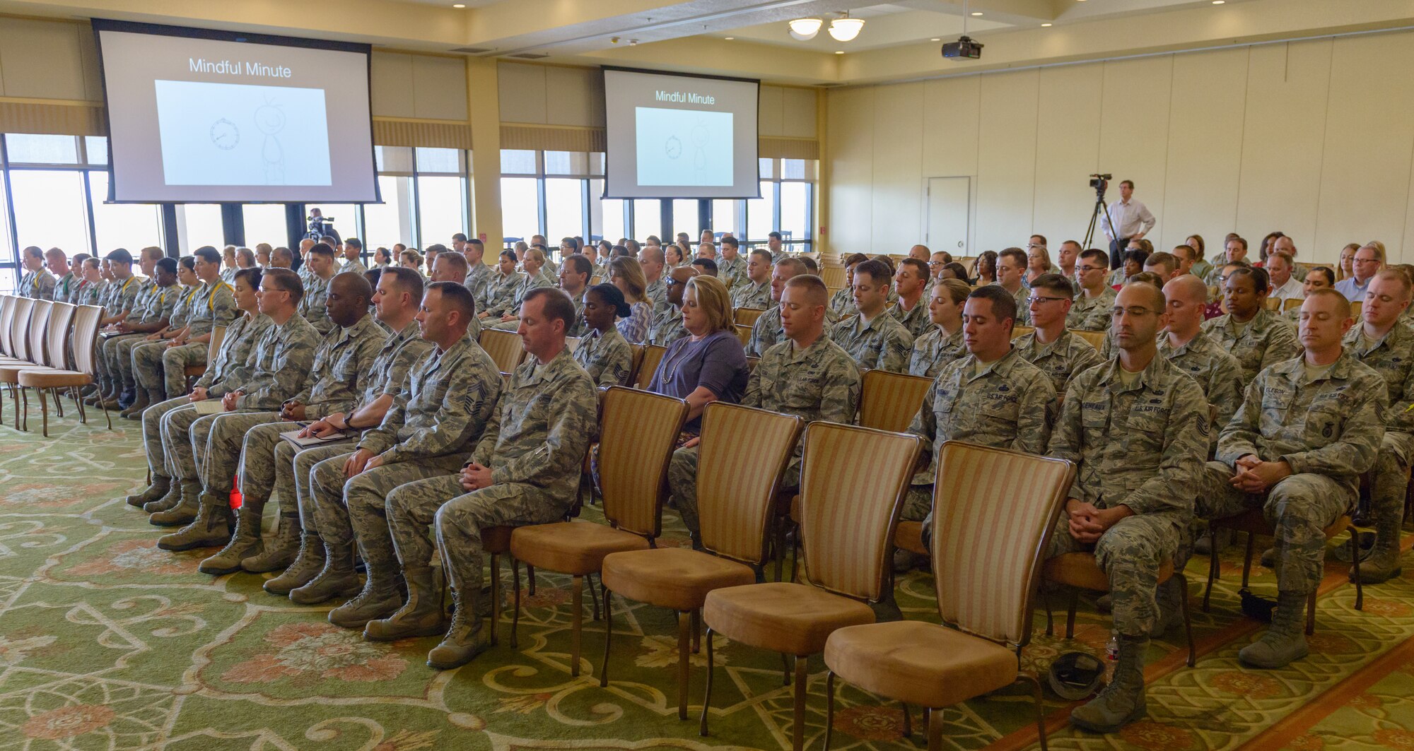 Keesler personnel participate in a stress release exercise led by U.S. Air Force Lt. Col. Jannell MacAulay,  58th Special Operations Wing mindfulness and human performance consultant, Kirtland Air Force Base, New Mexico, in the Bay Breeze Event Center at Keesler Air Force Base, Mississippi, May 1, 2018. MacAulay provided guidance to Keesler personnel to assist in their growth as managers into effective, adaptive and agile leaders while managing the stressors of everyday life. (U.S. Air force photo by Andre’ Askew)
