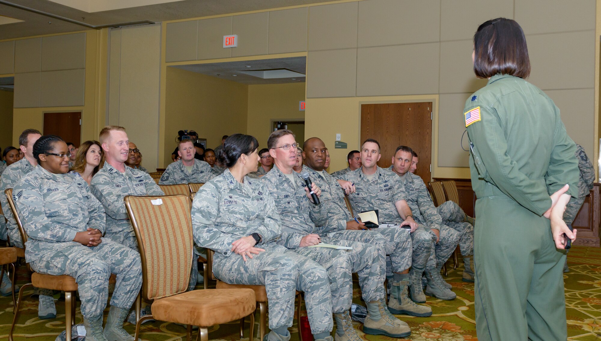 U.S. Air Force Col. C. Mike Smith, 81st Training Wing vice commander, asks Lt. Col. Jannell MacAulay,  58th Special Operations Wing mindfulness and human performance consultant, Kirtland Air Force Base, New Mexico, a question about mindful leadership techniques during her presentation in the Bay Breeze Event Center at Keesler Air Force Base, Mississippi, May 1, 2018. MacAulay provided guidance to Keesler personnel toassist in their growth as managers into effective, adaptive and agile leaders while managing the stressors of everyday life. (U.S. Air force photo by Andre’ Askew)