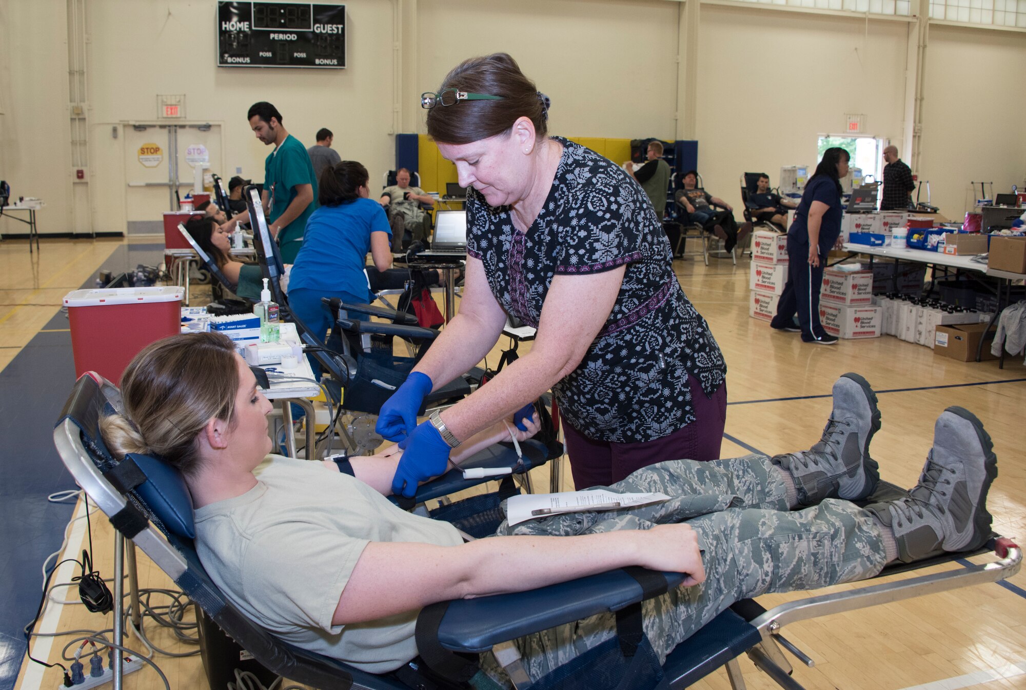 Airman 1st Class Brooke Bohrer, 60th Medical Support Squadron, donates blood, April 27, 2018, Travis Air Force Base, Calif. Since 2012, Travis AFB has supported 4,815 patients. Just one pint of donated blood can help save as many as three people's lives. (U.S. Air Force Photo by Heide Couch)
