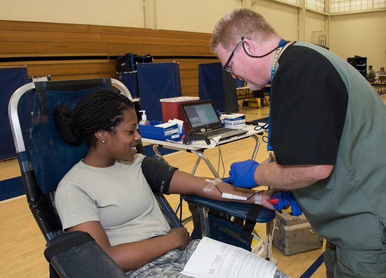 Staff Sgt. Anita Richard, 60th Medical Surgical Squadron, donates blood, April 27, 2018, Travis Air Force Base, Calif. Since 2012, Travis AFB has supported 4,815 patients. Just one pint of donated blood can help save as many as three people's lives. (U.S. Air Force Photo by Heide Couch)