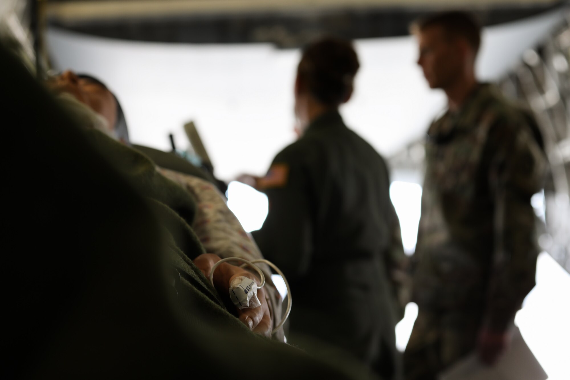 Graduating medical professionals from Madigan Army Medical Center carry a simulated patient onto a C-17 Globe - Master III on 25 April, 2018, at McChord Field, Wash. U.S. Army medical personnel are not often afforded the opportunity to see what happens to their patients while being transported to a facility like Landstuhl Regional Medical Center in German.
