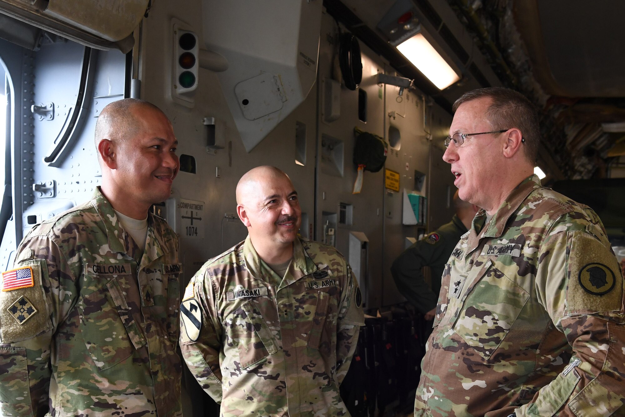 U.S. Army Maj. Gen. Arthur Logan, adjutant general for the Hawaii National Guard, left, visits with U.S. Army Staff Sgt. Alvin Cellona and Chief Warrant Officer 2 Walter Iwasaki, both of the U.S. Army Reserve’s 3302nd Mobilization Support Battalion, during a joint airlift inspection training event May, 5, 2018, at Joint Base Pearl Harbor-Hickam, Hawaii. The event, which included the 3302nd MSB from Fort Shafter, Hawaii, and the Hawaii Air National Guard’s 204th Airlift Squadron and U.S. Air Force Reserve’s 48th Aerial Port Squadron at JBPH-H, Hawaii, was a collaborative effort to build working relationships between services, improve proficiencies, and teach participants how to inspect vehicles and cargo for airlift operations. (U.S. Air Force photo by Master Sgt. Theanne Herrmann)
