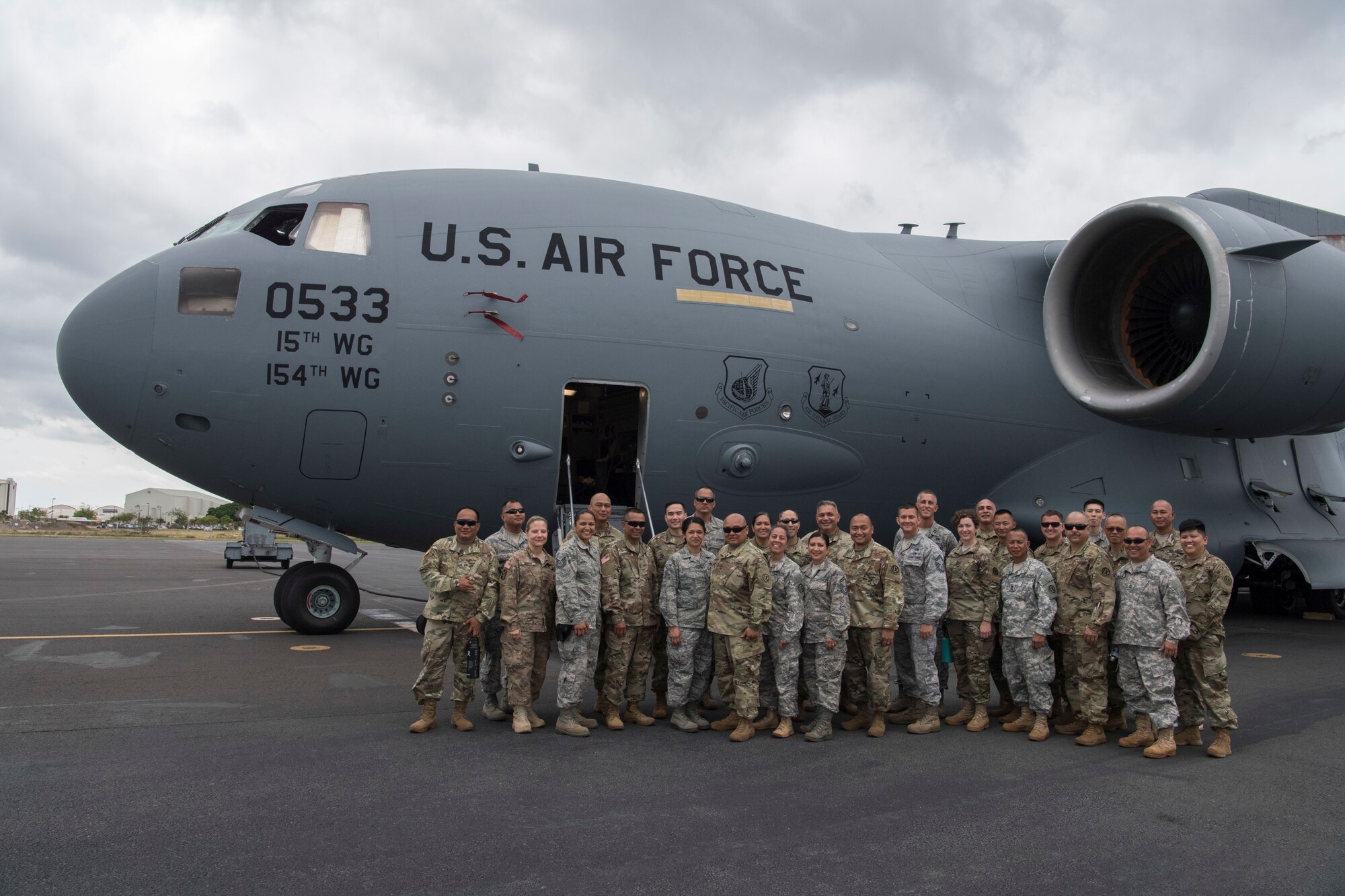 Members from the U.S. Army Reserve’s 3302nd Mobilization Support Battalion, Hawaii Air National Guard's 204th Airlift Squadron and U.S. Air Force Reserve's 48th Aerial Port Squadron complete a joint airlift inspection training event May, 5, 2018, at Joint Base Pearl Harbor-Hickam, Hawaii. The event, which included the 3302nd MSB from Fort Shafter, Hawaii, and the 204th AS and 48th APS at JBPH-H, Hawaii, was a collaborative effort to build working relationships between services, improve proficiencies, and teach participants how to inspect vehicles and cargo for airlift operations. (U.S. Air Force photo by Master Sgt. Theanne Herrmann)