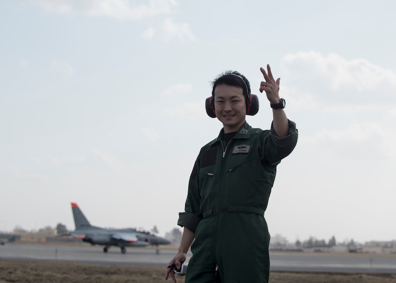 Japan Air Self-Defense Force 1st Lt. Yoshinobu Sasaki, a 3rd Fighter Squadron F-2 pilot, poses for a photo during dissimilar air combat tactics operations at Misawa Air Base, Japan, April 12, 2018. Sharing talents and abilities during DACT operations is an area of common interest for both JASDF and U.S. forces members. (U.S. Air Force photo by Airman 1st Class Collette Brooks)