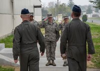 Three Team Misawa Airmen salute U.S. Air Force Col. R. Scott Jobe, left, the 35th Fighter Wing commander, and USAF Brig. Gen. Jeffrey C. Bozard, right, the 5th Air Force vice commander, at Misawa Air Base, Japan, May 2, 2018. Bozard reminded service members that building international relationships contributes to airpower capabilities and mission success. (U.S. Air Force photo by Airman 1st Class Collette Brooks)