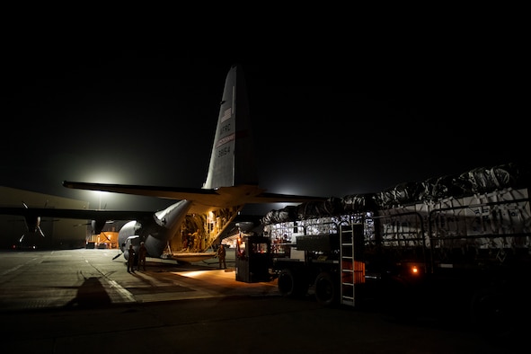 A C-130J Super Hercules and its aircrew assigned to the 746th Expeditionary Airlift Squadron from Al Udeid Air Base, Qatar, loads cargo destined for an undisclosed location in Afghansitan, May 5, 2018.  The 774th EAS is an active duty unit based out of the 41st Airlift Squadron, Little Rock, Ark, that worked together with the 746th EAS, a reserve unit based out of the 403rd Wing at Keesler Air Force Base, Miss. The mission represents the first dual-formation airdrop consisting of aircraft from two separate units. (U.S. Air Force photo by Senior Airman Xavier Navarro)