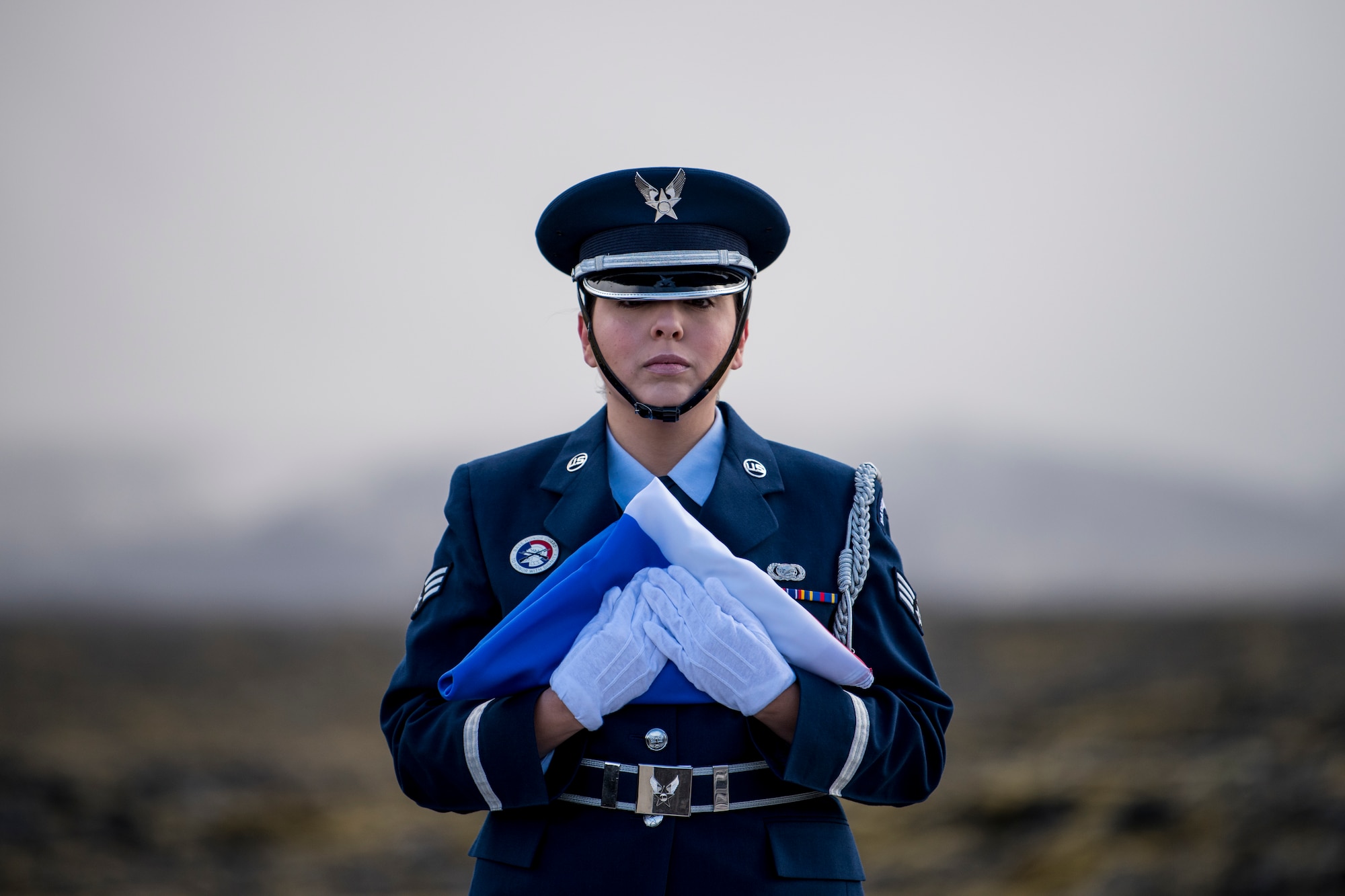 An Airmen assigned to the Spangdahlem Air Base Honor Guard prepares to raise the Iceland flag during the opening ceremony of a monument dedication, May 3, 2018 in Keflavic, Iceland. The ceremony recognized the 75th anniversary of the crash of a B-24 Liberator which resulted in the death of Lt. Gen. Frank Maxwell Andrews and 13 members of his crew. (U.S. Air Force photo/Tech. Sgt. Robert Cloys)