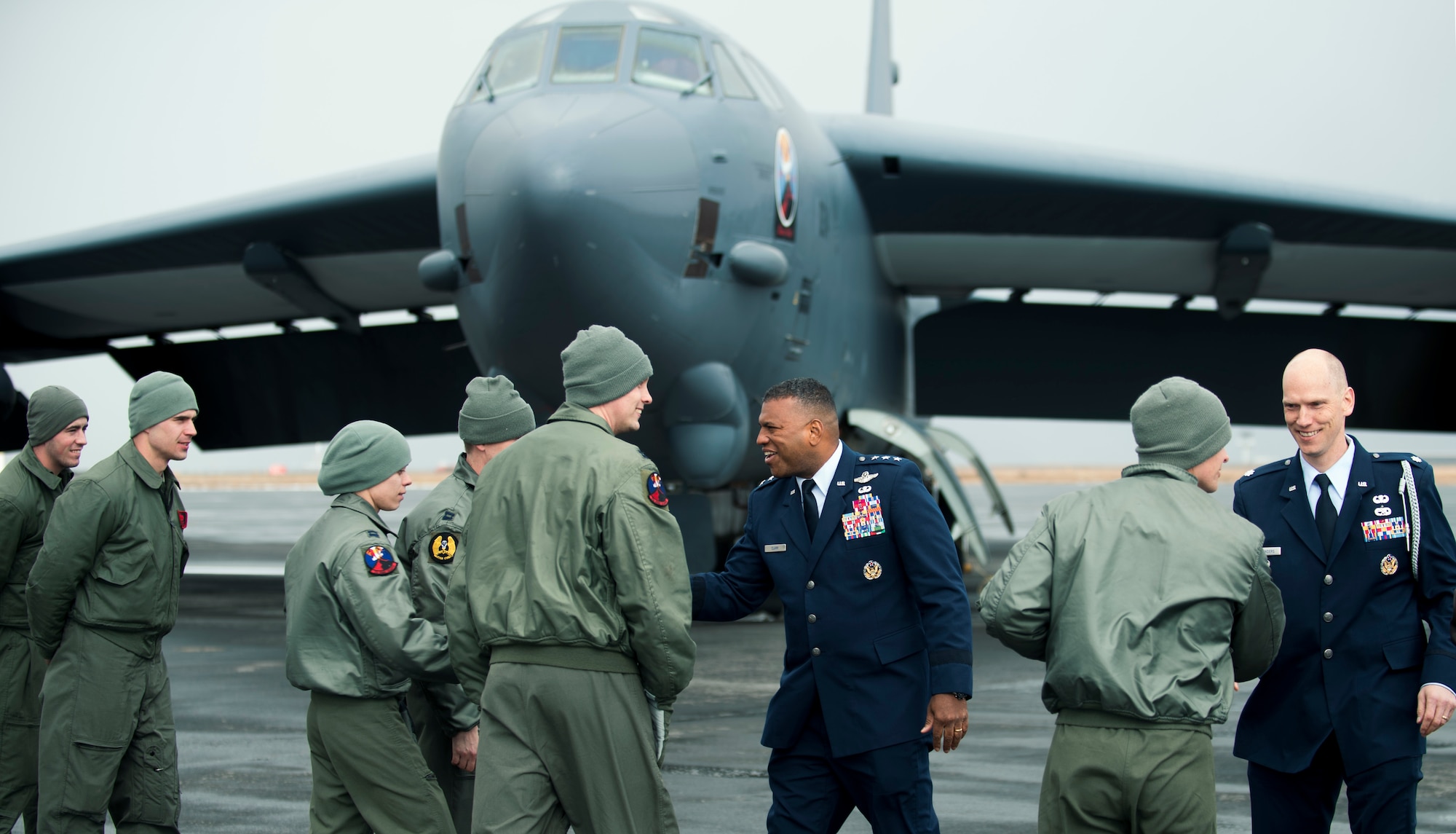 Lt. Gen. Richard Clark, 3rd Air Force commander, welcomes the crew of a United State Air Force B-52 Stratofortress, deployed from Minot Air Force Base, N.D., after a ceremonial flyover for a monument dedication to honor the crew of the B-24 Liberator “Hot Stuff” at Keflavic Air Station, Iceland, May 3, 2018.  As the “gateway to the Arctic,” Iceland serves as an important transit point to over 1,000 U.S., NATO military and government aircraft each year traveling between Europe and North America. (U.S. Navy photo by MC3 Evan Parker)