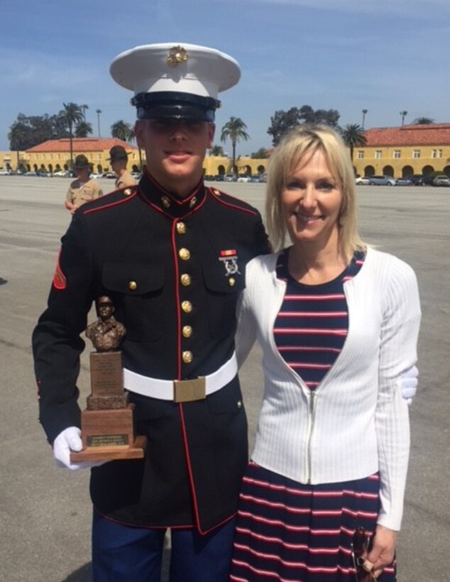 Lance Cpl. Bryson Bosch, who was recruited out of Recruiting Substation Metro East, Recruiting Station Denver, stands with his mother, Nikki Bosch, after his graduation ceremony at Marine Corps Recruit Depot San Diego, Calif. April 6, 2018. Bosch was the company Honor Graduate of Charlie Company, a distinction that earned him his meritorious promotion to lance corporal.