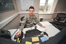 U.S Air Force Senior Airman Dimas Bernacchia 100th Comptroller Squadron military pay technician, updates an Airma’s pay records at RAF Mildenhall, England, April 17, 2018. The 100th CPTS and 100th Force Support Squadron are testing an Air Force Specialty Code merger, to test having a CPTS Airman in place at the MPF. (U.S. Air Force photo by Senior Airman Christine Groening)