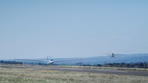 A 94th Flying Training Squadron glider and tow aircraft land at the Air Force Academy, Colo., May 8, 2018, as part of an orientation flight for the wounded warriors. Eight veterans received an opportunity to ride on a glider and soar over the Front Range. (U.S. Air Force photo/Master Sgt. Julius Delos Reyes)