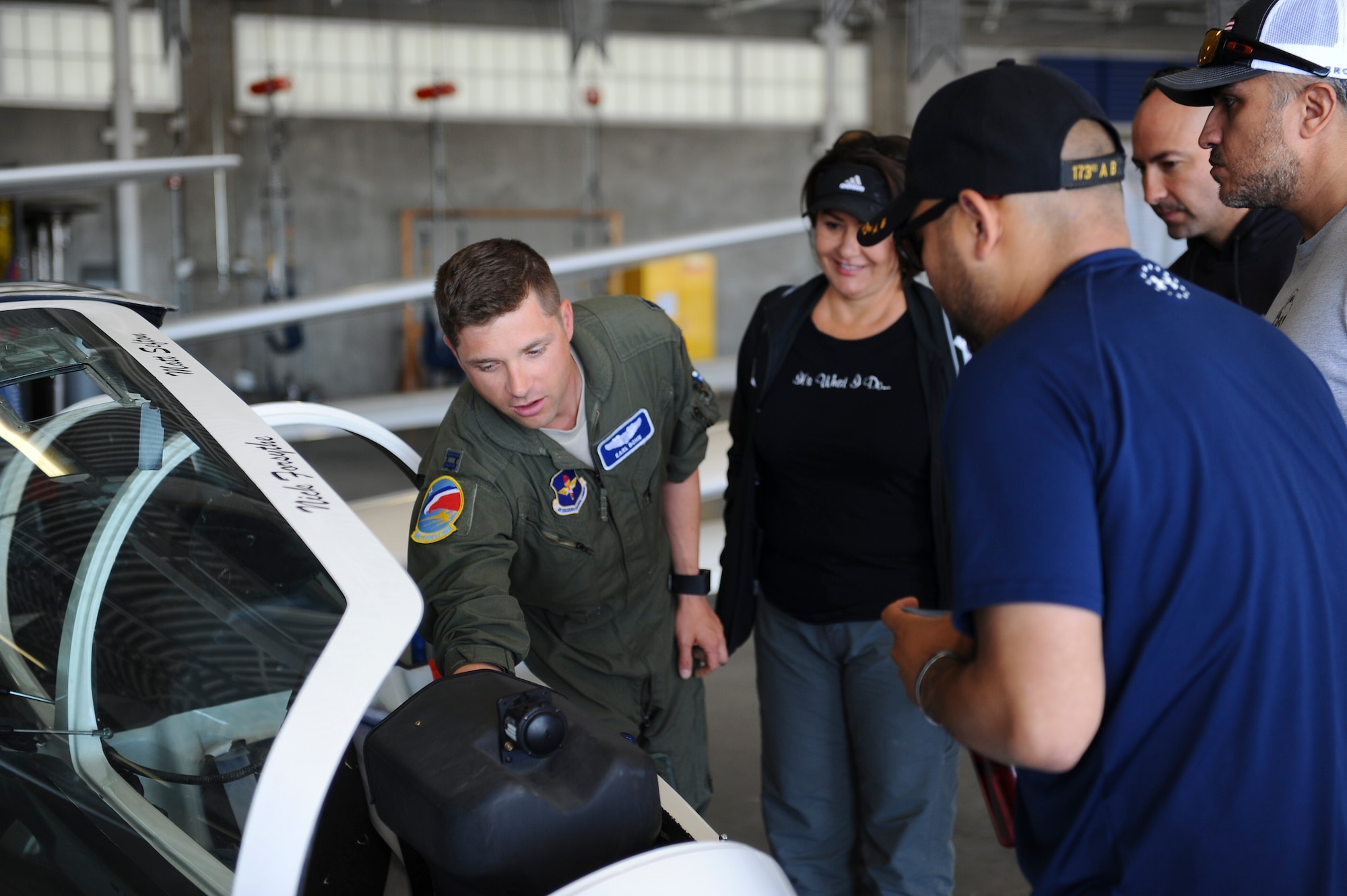 Capt. Karl Bohn, 94th Flying Training Squadron, highlights the different aspects of a glider cockpit prior to the orientation flight for the wounded warriors May 8, 2018, at the Air Force Academy, Colo. The training squadron partnered with the Soaring Eagle Foundation and the Wounded Warrior Program to provide eight veterans the opportunity to soar over the Front Range. (U.S. Air Force photo/Master Sgt. Julius Delos Reyes)